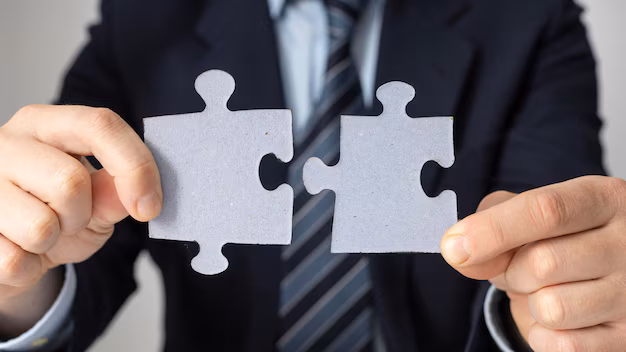 businessman-holding-two-puzzle-pieces_23-2148793765